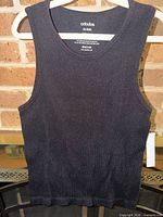 Front view of black ribbed Ododos tank