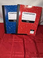 Front view of both red and blue Scholar composition notebooks