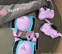 Full set with bag, knee pads, wrist guards visible
