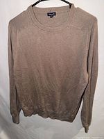 Front view of Splendid taupe beige crewneck sweater on hanger
