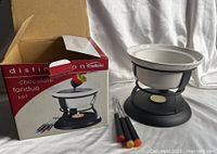 Box, assembled set, three forks visible