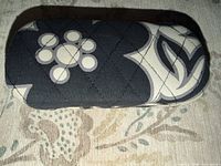 Top view of quilted hard shell case showing floral geometric pattern