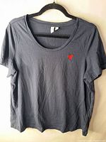 Full front view of navy short sleeve top