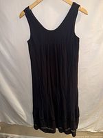 Front view of black midi sundress on hanger