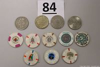 All 12 tokens and chips laid out showing fronts