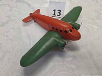 Top view of red fuselage and green wings