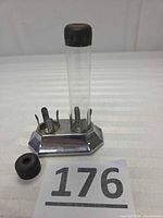 holder assembled showing intact tube and spare cap