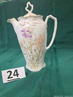 Full view of porcelain chocolate pot with lid attached