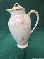 Full view of porcelain chocolate pot with lid in place