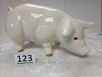 Right side view of ceramic pig figurine