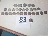 All 28 coins laid out in rows