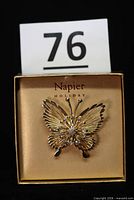 Full view of brooch in box with lot number card