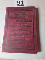 Front cover of red cloth hardcover showing full Italian title and publisher