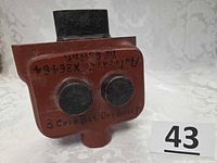front view showing two round dowel cores, handwritten codes