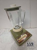 Full view of assembled avocado green Sears Insta-Blend blender with glass jar and lid
