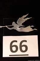 Front view of sterling angel trumpet brooch