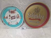 Overall view of both Schlitz and Schmidt's trays, showing fronts and relative sizes