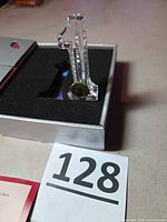 Crystal numeral 1 in box with foam insert and seahorse label visible