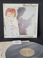 Front cover of David Bowie Scary Monsters LP with record displayed