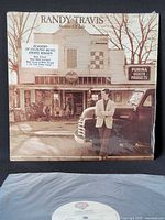 Front jacket with shrink and hype sticker plus partial view of record label