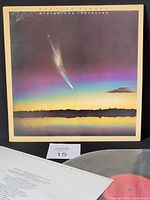 Front album cover with vinyl and inner sleeve partially visible