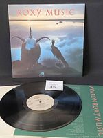 Front of jacket with vinyl record and inner sleeve visible