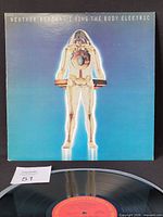 Front cover of Weather Report LP with record partially visible