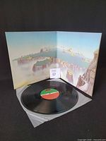 Open gatefold with record and inner sleeve visible