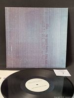 Front of jacket with vinyl record visible