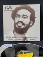 Front cover with artist portrait and title