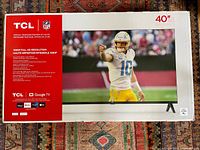 Front of sealed TCL 40" Google TV retail box