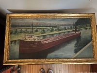 Front view of framed oil painting showing full ship scene