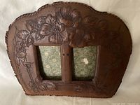 Front view showing full design, twin openings, floral embossing