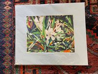 Full view of matted painting on patterned carpet