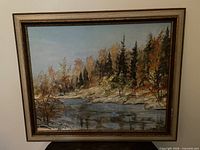 Front view of framed J. Marley oil landscape painting