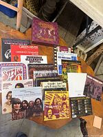 Group shot of CCR Singles Collection box and multiple 45 RPM picture-sleeve records spread on table