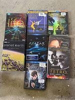 Front covers of eight video cases laid out