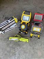 Overall view of two Alpena boxed light bars and four portable/shop lights