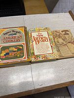 Front covers of all three cookbooks displayed side by side