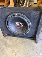 Front view of MTX subwoofer cone in enclosure