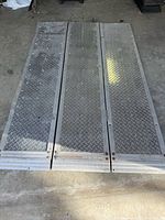 Ramp unfolded showing three diamond tread panels