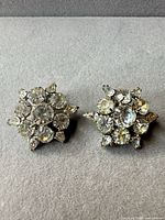Front view showing rhinestone cluster design on both earrings