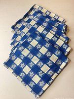 All four napkins stacked showing pattern and color