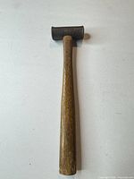 Full view of hammer showing steel head and wood handle