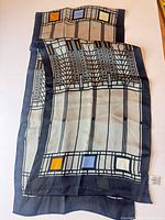 Full view of rectangular silk scarf showing overall pattern and colors