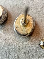 Reverse of one earring showing Givenchy hallmark and post