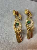 Front view of both earrings showing design and condition