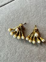 Front view of both earrings showing overall design and condition