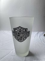 Single frosted pint glass front view showing Harley-Davidson Bar & Shield logo