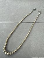 Full view of graduated faux pearl necklace